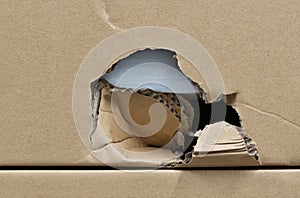 Damaged cardboard box broken shipping freight.