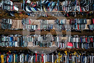 Damaged cars waiting in a scrapyard to be recycled or used for s