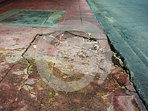 Damaged cements footpath.