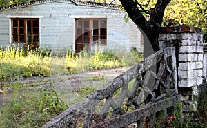 Damaged concrete fence of old abandoned sanatorium