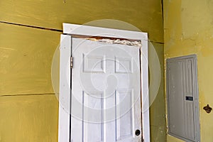 Damaged door frame on house with foundation problems