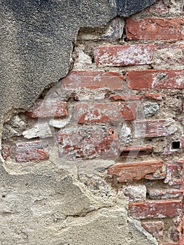 Damaged Exposed Red Brick Wall in Europe