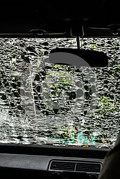 Damaged glass (car windshield) inside car