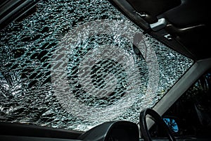 Damaged glass (car windshield) inside car