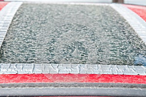 Damaged glass roof window or sunroof on the red car glued with duct tape to prevent water to come in the interior of the vehicle