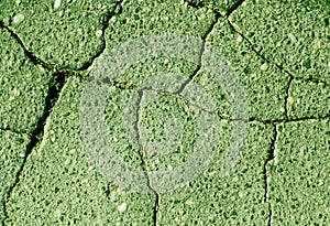 Damaged green toned asphalt texture
