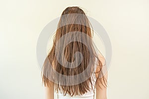 Damaged hair, frustrated asian young woman, girl in splitting ends, messy unbrushed dry hair and frizzy with long disheveled hair
