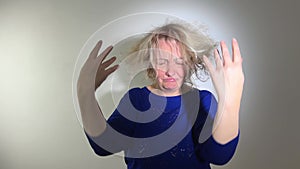 Damaged Hair. Sad adult Woman With Disheveled Hair. Closeup Portrait Of Female Model Holding Unbrushed Dry Hair In Hands