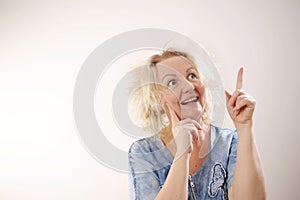 Damaged Hair. Sad adult Woman With Disheveled Hair. Closeup Portrait Of Female Model Holding Unbrushed Dry Hair In Hands