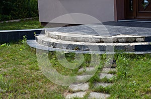 Damaged house staircase or stairs with broken tiles over concrete steps