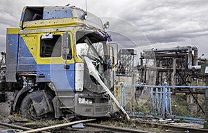 Damaged and looted car and destroyed buildings of the workshop of the Azovstal plant in Mariupol