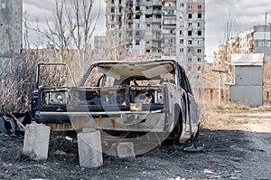 damaged and looted cars in a city in Ukraine during the war