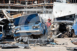 damaged and looted cars in a city in Ukraine during the war