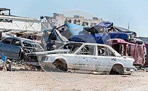 damaged and looted cars in a city in Ukraine during the war