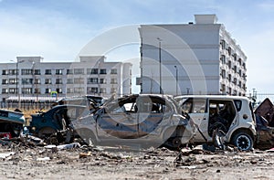 damaged and looted cars in a city in Ukraine during the war