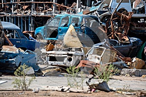 damaged and looted cars in a city in Ukraine during the war