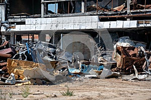 damaged and looted cars in a city in Ukraine during the war