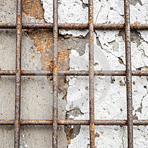 Damaged metal background with grate