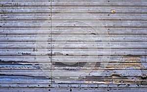 Damaged metallic surface, truck body detail, Rio