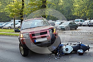 Damaged motobike and a car in a accident