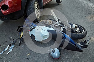 Damaged motobike and a car in a accident