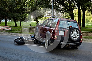 Damaged motobike and a car in a accident