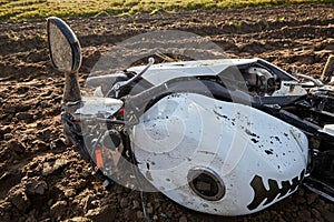 Damaged motorbike after collision with wild animal