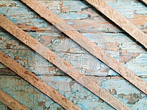 Damaged old grunge wood blue wall with peeling paint texture