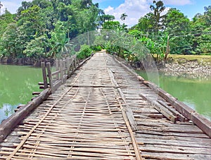 Damaged old wooden bridge in the village