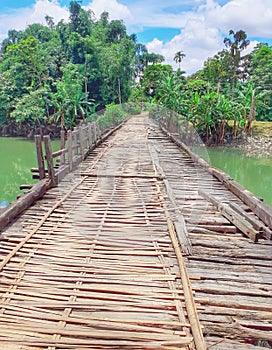 Damaged old wooden bridge in the village