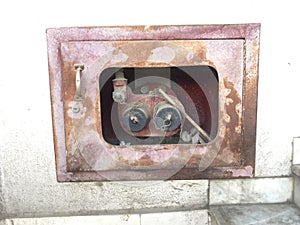 Damaged paint or Corroded or rusted two way breeching inlet of an Fire fighting System to connect all landing valves for an High photo