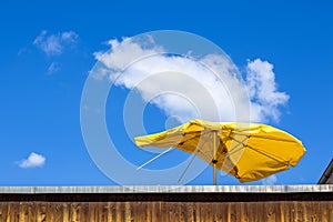 Damaged parasol on roof terrace