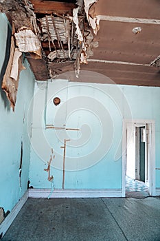 Damaged, rotting and collapsing ceiling in an abandoned building in Bannack ghost town Montana photo