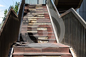 Damaged staircase. Old staircase in the metropolis. Broken stairs on a flight of stairs