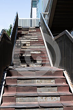 Damaged staircase. Old staircase in the metropolis. Broken stairs on a flight of stairs