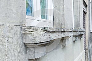 A damaged stone window back with chipped corners, Germany