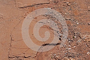 DAMAGED TARRED ROAD