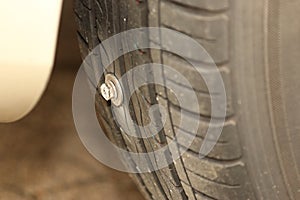 Damaged tire due to screw or nail in the tire