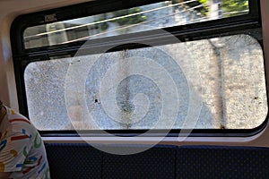 Damaged train window in Kuala Lumpur, Malaysia