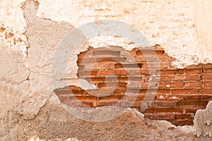 Damaged wall with red  brick part showing closeup, background/ texture.