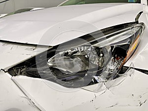 Damaged White Toyota car.