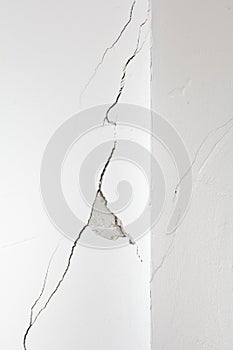 damaged white wall crack rip