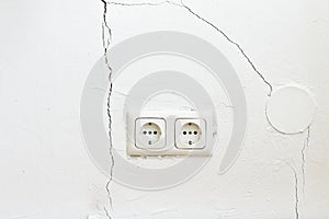 damaged white wall cracks rips