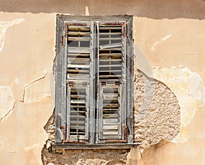 damaged window in old uninhabited house