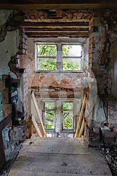 Damaged windows of a ruined mansion