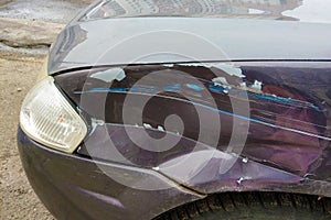 Damaged wing in a car after an accident. close-up