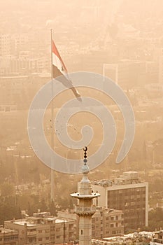 Damascus, capital of Syria with Syrian flag.