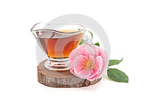 Damask rose flower and tea isolated on white background