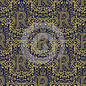 Damask seamless pattern repeating background. Golden blue floral ornament with R letter and crown in baroque style