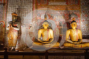 Dambulla Golden Cave Temple: Buddha statues carved on the rocks.